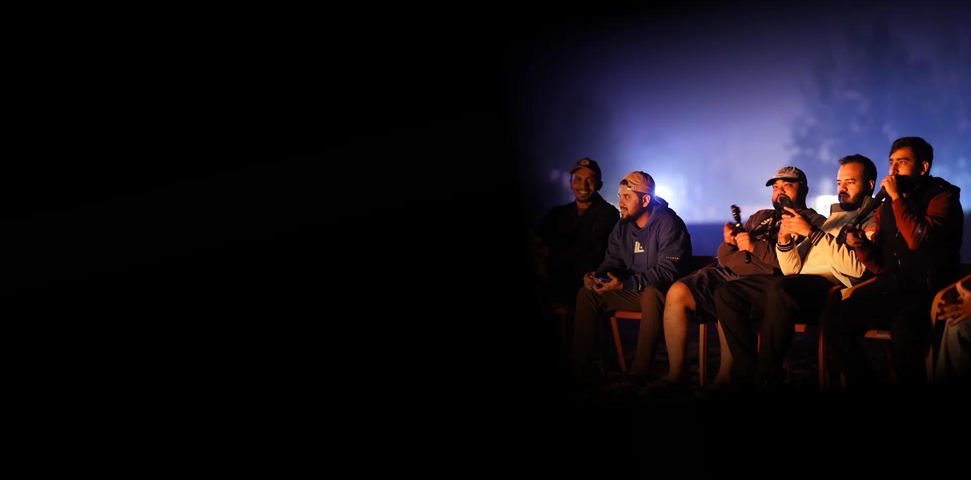 Mediusware team members seated together at an outdoor evening event
